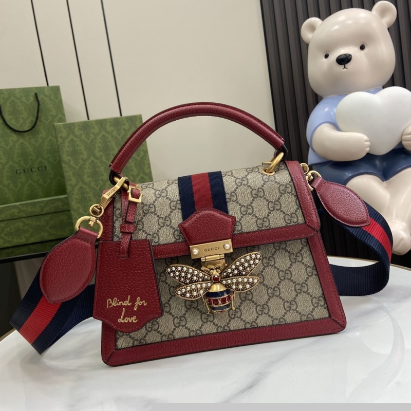 G*u*i top handle bags
